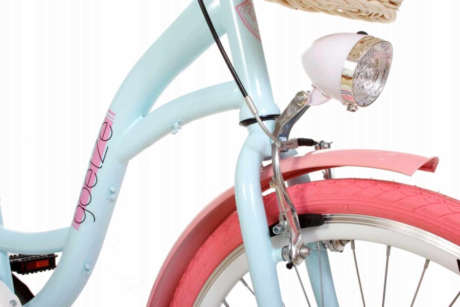 Bicicletă albastră și roz cu far frontal.