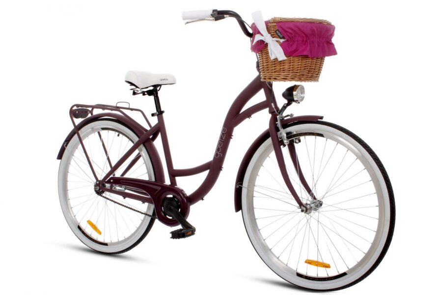 Bicicletă vintage cu coș de răchită roz.