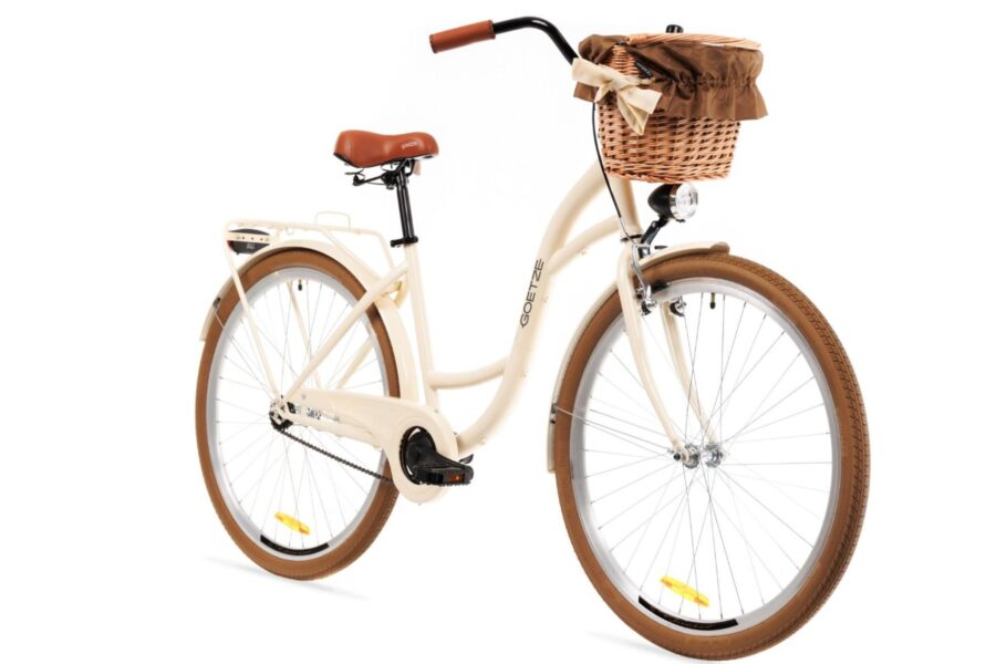 Bicicletă retro crem cu coș din nuiele.