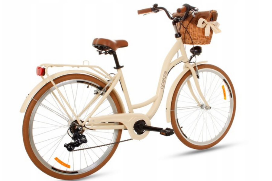 Bicicletă vintage crem cu coș și șa maro.