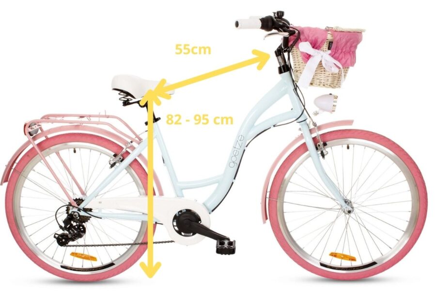 Bicicletă albă cu coș și anvelope roz.