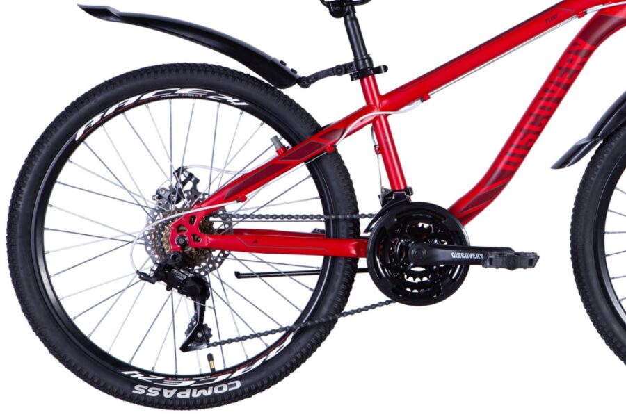 Bicicletă roșie cu roți și lanț vizibile.