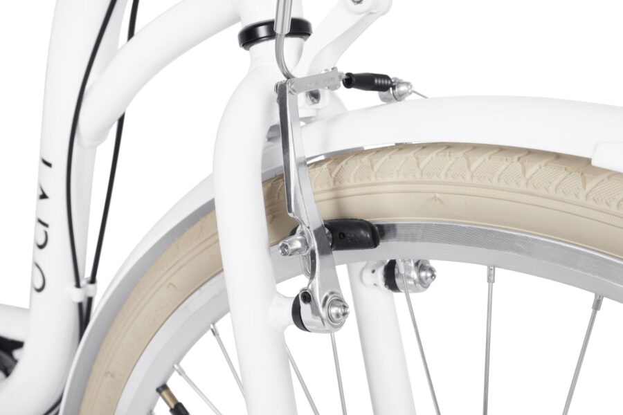 Detaliu frână bicicletă albă cu roată.